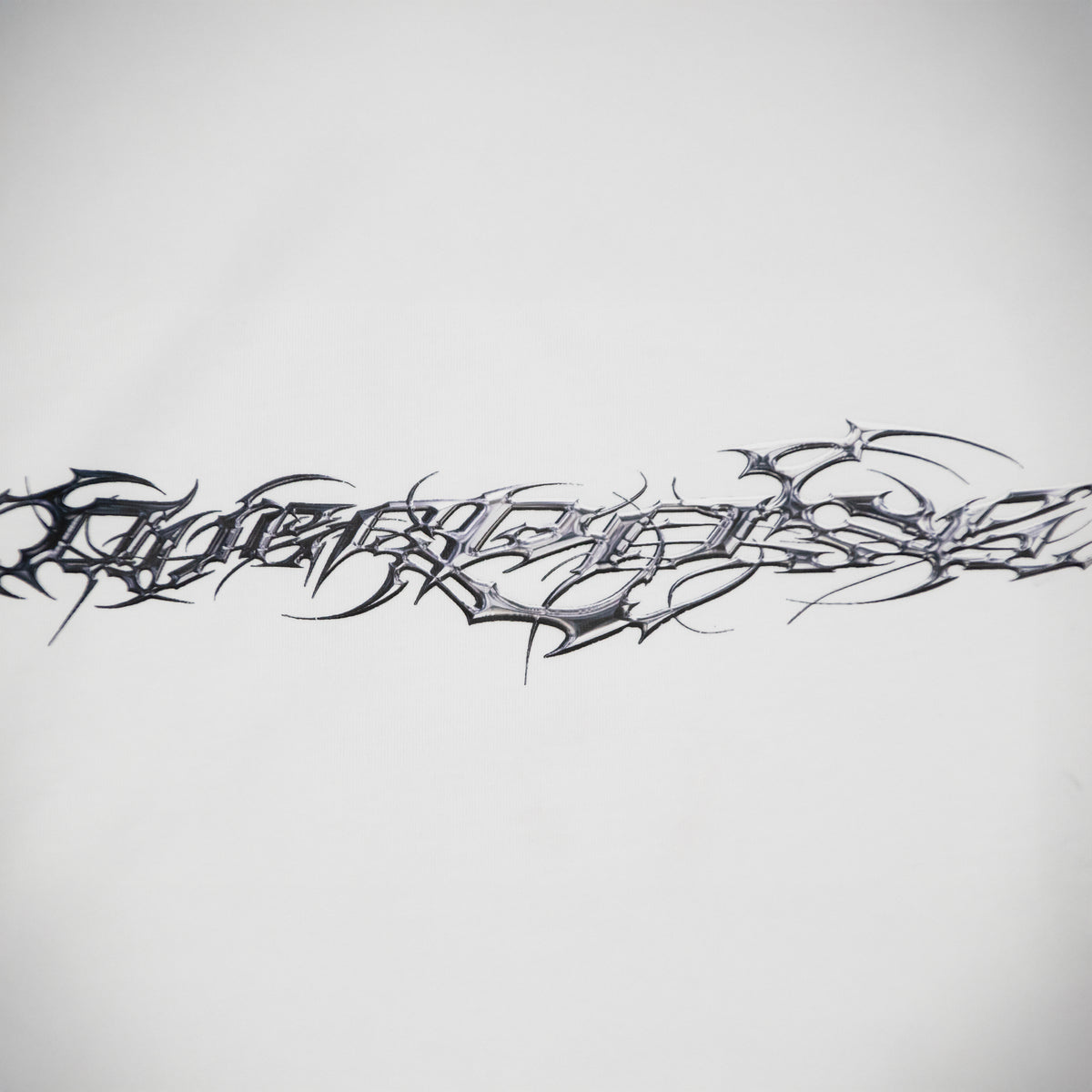 "TRIBAMETAL" LOGO TRNSFRMR L/S - ANGEL